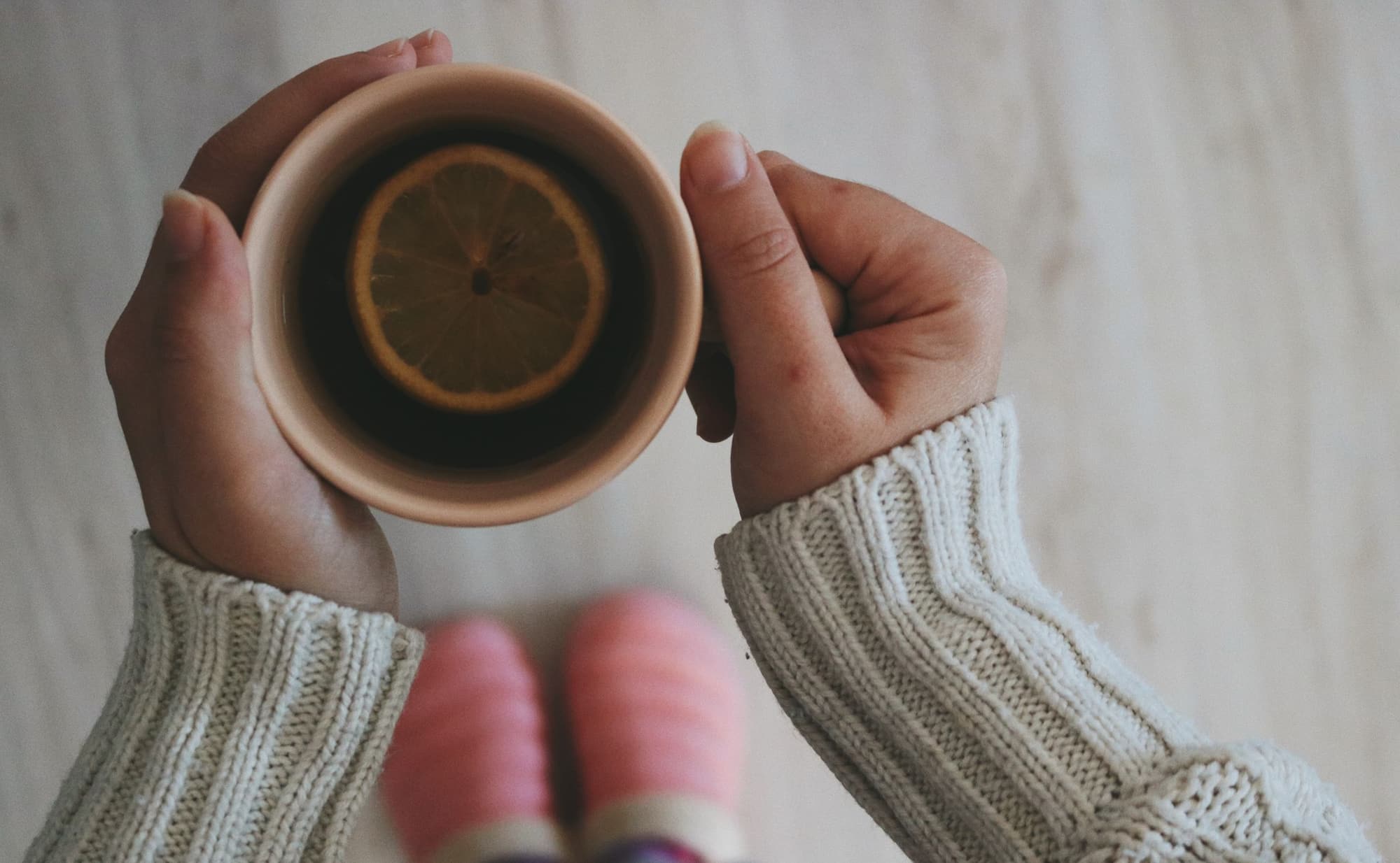 Hands holding a cup of tea